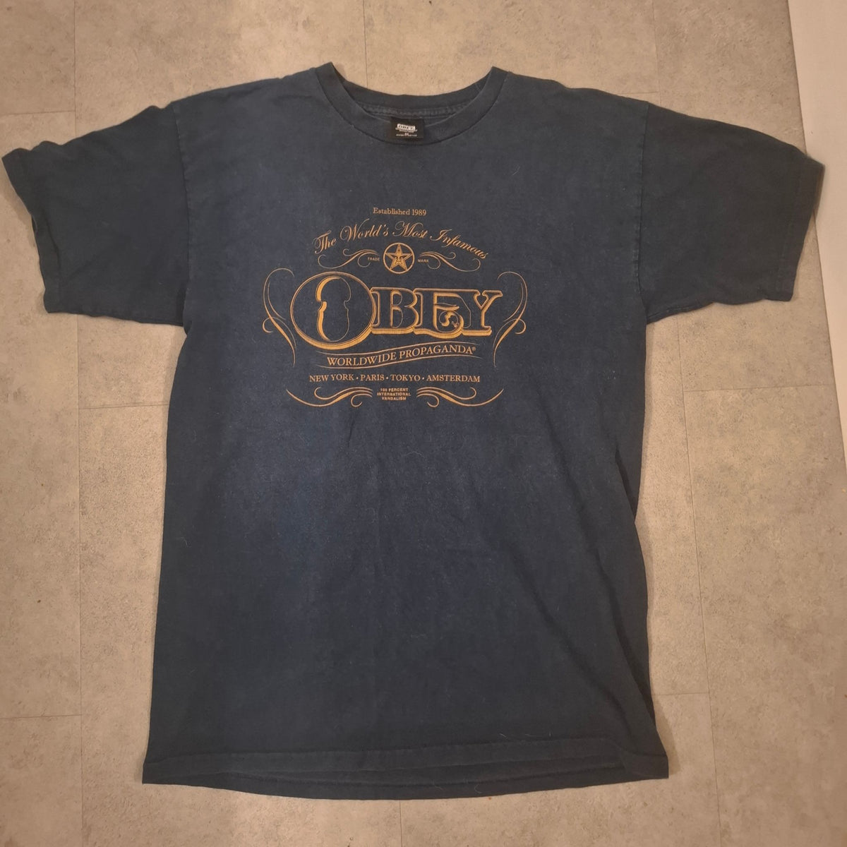 [PRE-OWNED] OBEY "Worldwide Propaganda" Graphic T-Shirt – Faded Navy Blue